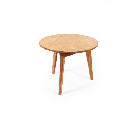 Attributed to William Simmonds (1876-1968) an oak Arts &amp; Crafts style circular topped side table, on three tapering legs,
