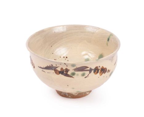 ARR Jim Malone (born 1946) a cream ground bowl with blue, grey and brown leaf decoration, 19cm x 13cm