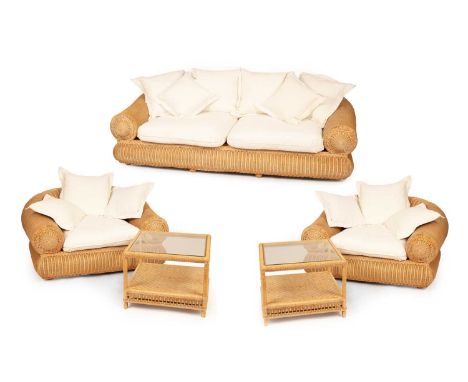 A 1980s rattan suite to include a sofa and two matching armchairs with white cushions and a pair of matching square glass top