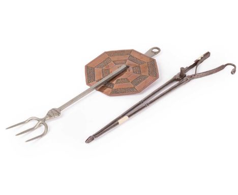 An Arts &amp; Crafts style toasting fork, from a design by Ernest Gimson, the steel fork with octagonal guard, 40cm long and 