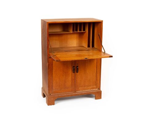 Gordon Russell (1892-1980) for Russell &amp; Co, circa 1920, an oak rectangular fall front bureau cabinet with bog oak shaped