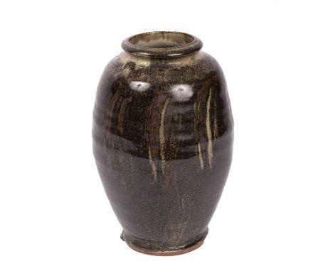 ARR Mike Dodd (born 1943) a bottle vase in a dark brown glaze, with brushes of light green decoration to the body, 28.5cm hig