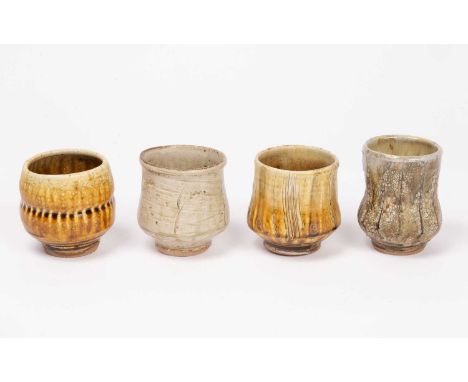 ARR Mike Dodd (born 1943) a yunomi style beaker decorated by vertical linear incisions in yellow and brown glaze, 9cm high, a