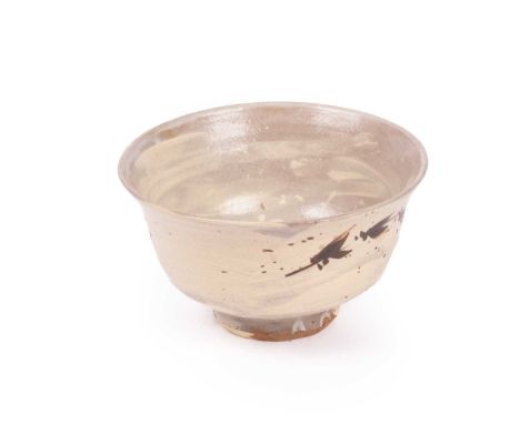 ARR Jim Malone (born 1946) a cream ground bowl with leaf decoration, 19cm x 12cm