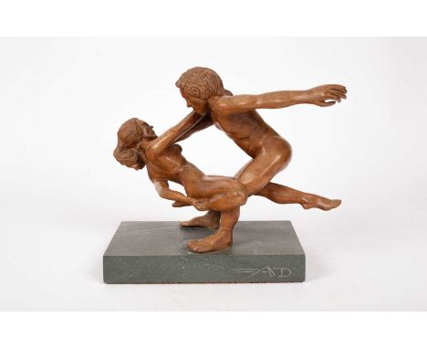 ARR Dave Johnson (Contemporary) a carving of a couple, on a rectangular stone base, signed25cm high x 31cm wide