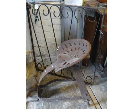 Vintage cast iron tractor seat together with a cast iron garden gate.  (2)  (B.P. 21% + VAT) 