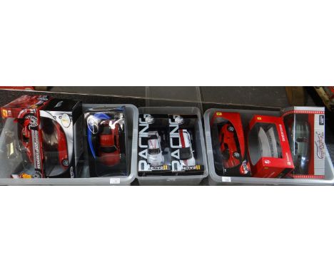 Three plastic boxes of model sports cars, to include: Maisto 1:18 scale Peugeot 307, Hot Wheels 1:18 Scaglietti Collection Ra