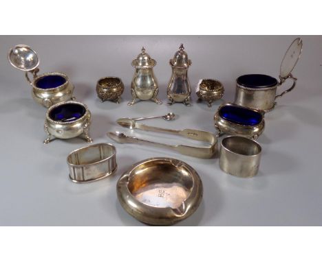 Collection of silver to include: mustard pot, various condiments, napkin ring 19th century sugar nips, ashtray etc.  20 troy 