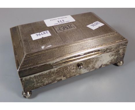 Art Deco design engine turned silver ring/jewellery casket standing on four ball feet. Birmingham hallmarks. Weight including