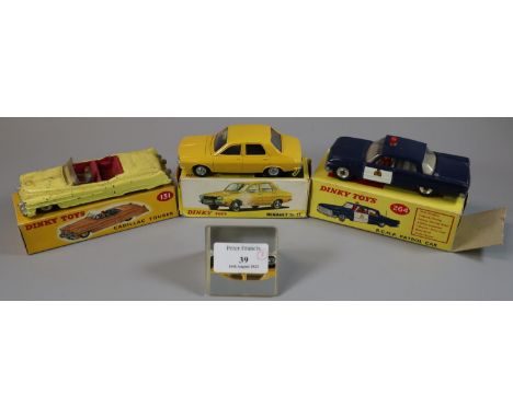 Dinky toys 264 R.C.M.P. patrol car, together with a Dinky toys 131 Cadillac Tourer and a Dinky toys 1424 Renault 12TL. All in