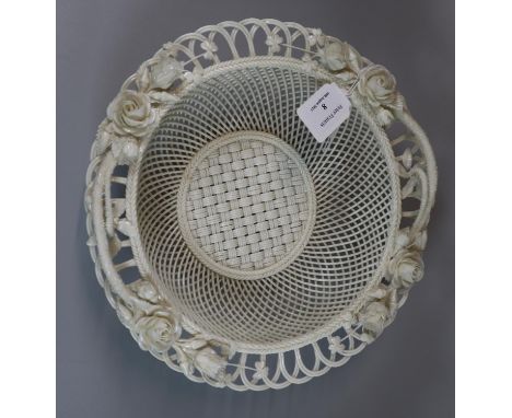 Probably Belleek, lattice and pierced design woven basket decorated with relief roses and foliage. 26cm diameter approx. Unma