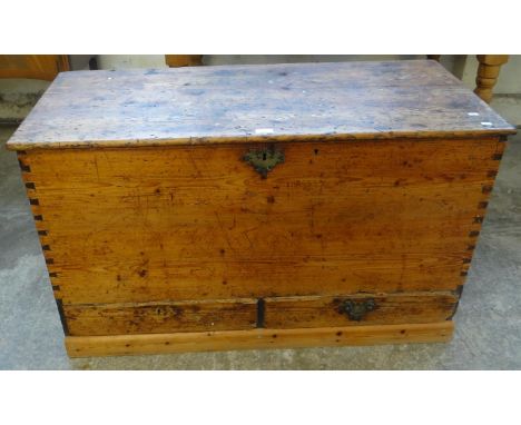 19th century pine trunk, the hinged lid with candle box and fitted drawer above two pullout drawers to the base.  (B.P. 21% +