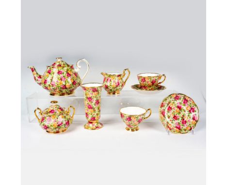 Bone china tea set in a magenta, gold and pink roses design, gold rims and handles. Royal Albert backstamp. Teapot 10"L x 5.7