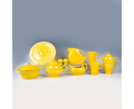 This bright service grouping includes a water pitcher, a lidded coffee pitcher, gravy boat, covered serving bowl, covered tea