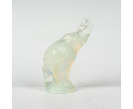 A small elephant, balancing a ball on its trunk. Sabino Paris marked on the underside. Dimensions: 1.75"L x 1"W x 2.25"HManuf