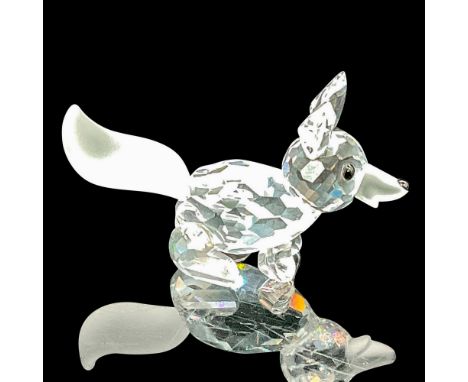 This fox figure showcases a clear faceted head and body, enhanced by a black nose and eyes, capturing the essence of this ele