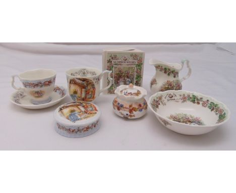 Royal Doulton Brambly Hedge porcelain to include a money box, dishes, a jug, cups and saucers (8)
