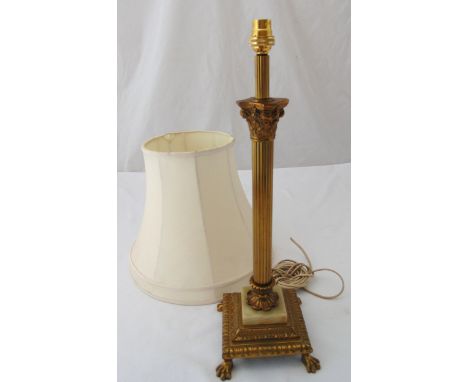 A gilt metal Corinthian column table lamp stand on raised square base with claw feet, to include shade, 52.5cm (h)
