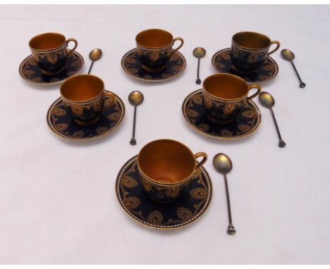 A set of six Royal Worcester coffee cups, saucers with matching hallmarked silver coffee spoons (18)