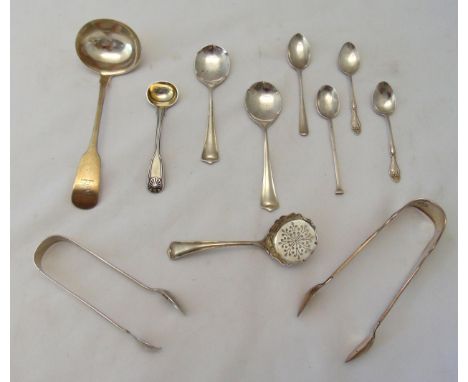 A quantity of hallmarked silver flatware to include a William IV Irish cream ladle, tongs, a sugar sifter and condiment spoon