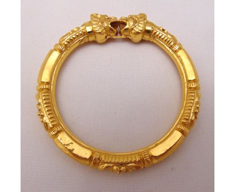 Yellow gold bangle with lion masks, gold tested 22ct, approx total weight 24.0g