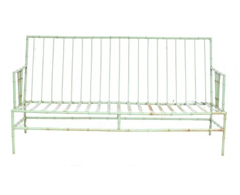 A green painted wrought iron faux bamboo garden sofa, with cushions, 152cm wideProvenance: from the estate of the late Antoni