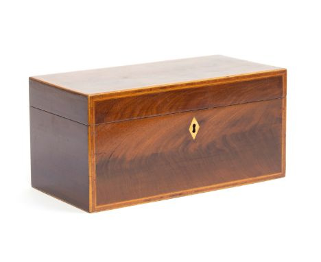 An early 19th century mahogany and crossbanded tea caddy, complete with two lined canisters and glass sugar bowl, 30cm wide