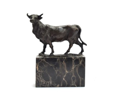 After Louis-Albert Carvin (French, 1875-1951), a bronze sculpture of a cow, signed 'L. CARVIN', on a marble plinth base, 17.8