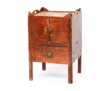 A George III painted pine bedside commode, the galleried top with cutout handles, over two cupboard doors, and a pull out com