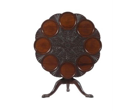 A carved mahogany supper tripod table in George II Irish style, late 19th or early 20th century, the scalloped and dish top w