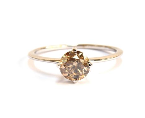 An 18ct white gold Australian diamond solitaire ring, the fancy champagne coloured diamond 1.05cts, size Q, gross weight 2g