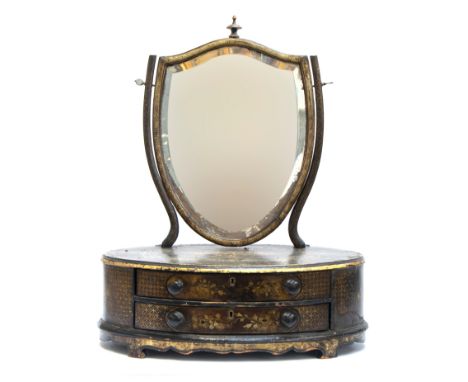 A 19th century Chinese export dressing mirror, the bevelled shield shaped plate on an oval base of two drawers, 54cm wide, 67