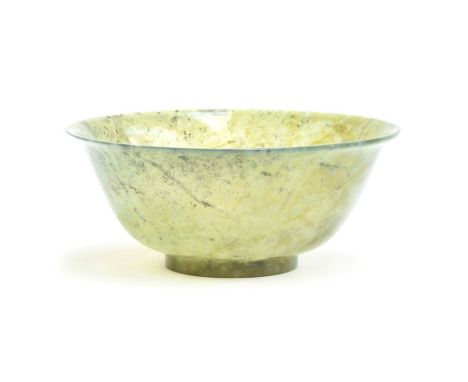 A Chinese carved spinach jade bowl, 15cm diameter