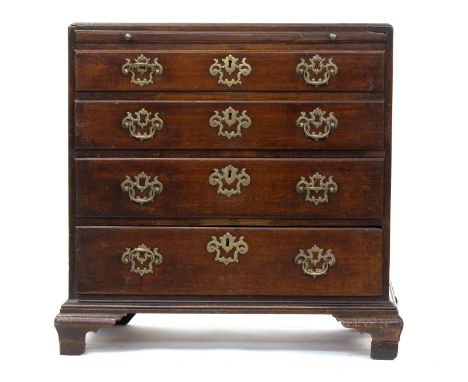A mid-18th century bachelor's chest, the caddy moulded top over a brushing slide and four graduating drawers, on ogee bracket