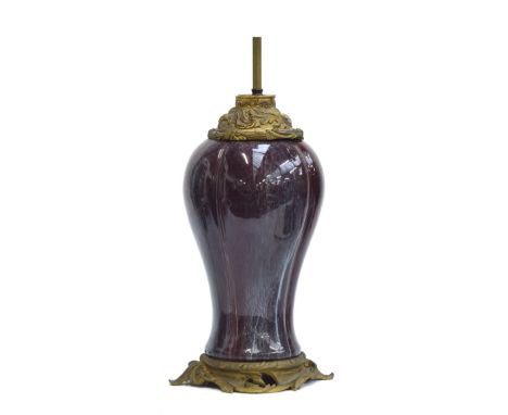 A 19th century flambe glazed ceramic lamp of baluster form in Chinese taste, converted from a vase, the base 41cm high, toget