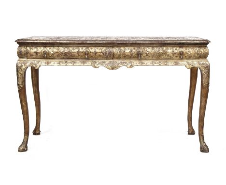 An 18th century Italian gilt gesso console table, the top worked in low relief, over two slides and two frieze drawers, the f