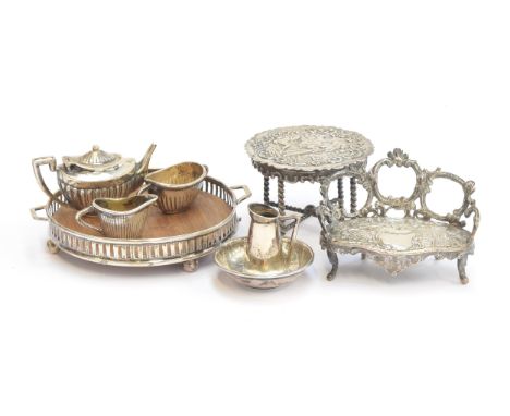 An early 20th century miniature silver dolls tea set, comprising galleried teapot, 3cm high, galleried tray, sugar bowl and m