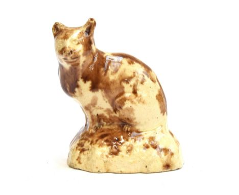 An 18th century Staffordshire Whieldon type glazed figure of a seated cat, 6.5cm high