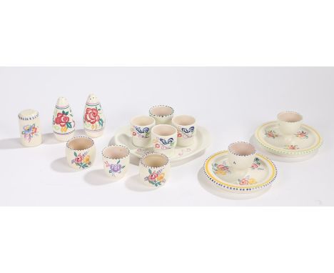 Poole pottery egg cruet with three egg cups, two egg cups with attached dish bases, three piece condiment set, four egg cups,