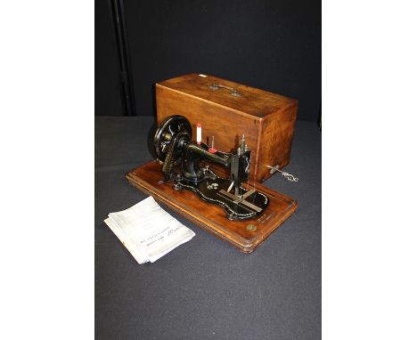 Frister Rossman manual sewing machine, housed in a marquetry inlaid case