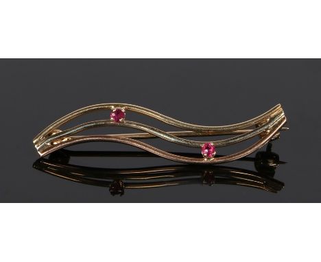 9 carat gold ruby set brooch, with three arched lines set with two rubies, 37mm long