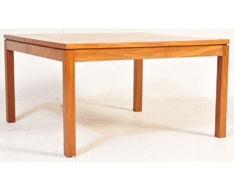 A retro vintage mid 20th century MOD / Ministry of Defence coffee table of square form having angular edges raised on upright