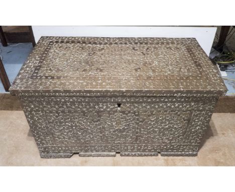 ZANZIBAR TRUNK, 19th century African teak with a rising lid and all over studded with applied brass detail, 110cm x 61cm D x 