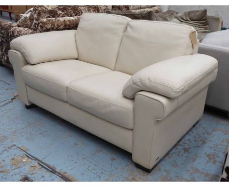 NATUZZI SOFA, two seater, cream leather, 175cm W x 90cm D.