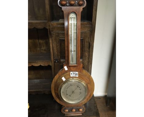 A walnut cased barometer length 62cm