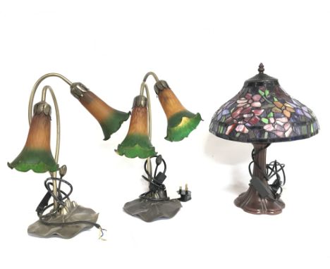 Three electric table lamps consisting of two glass &amp; metal lily pad lamps and a Tiffany style lamp, 44 &amp; 40cm tall. P