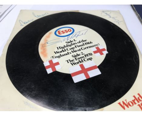 A Esso 1970 World Cup record with signatures . Together with football club  badges,