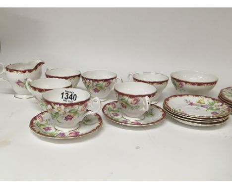 A decorative British fine bone china tea set Queen Anne six place setting complete with cream jug and sugar basin no obvious 