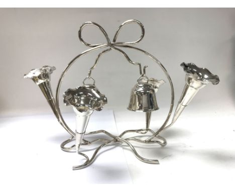 A collection of silver plated condiments and place mats along with an epergne candelabra. Shipping category B.