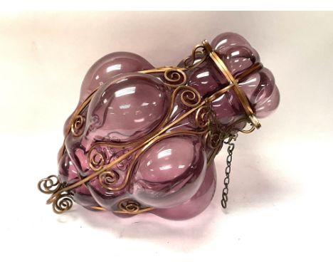 A 1970s Italian hand blown amethyst glass and metal worked hanging lamp. 39cm.